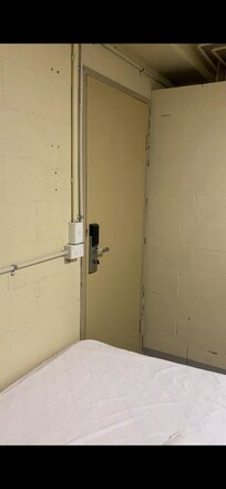 Door that has storeroom sign on it