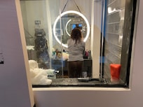 Voila! The picture slides to the side to allow a nice view into the bathroom. WTF?