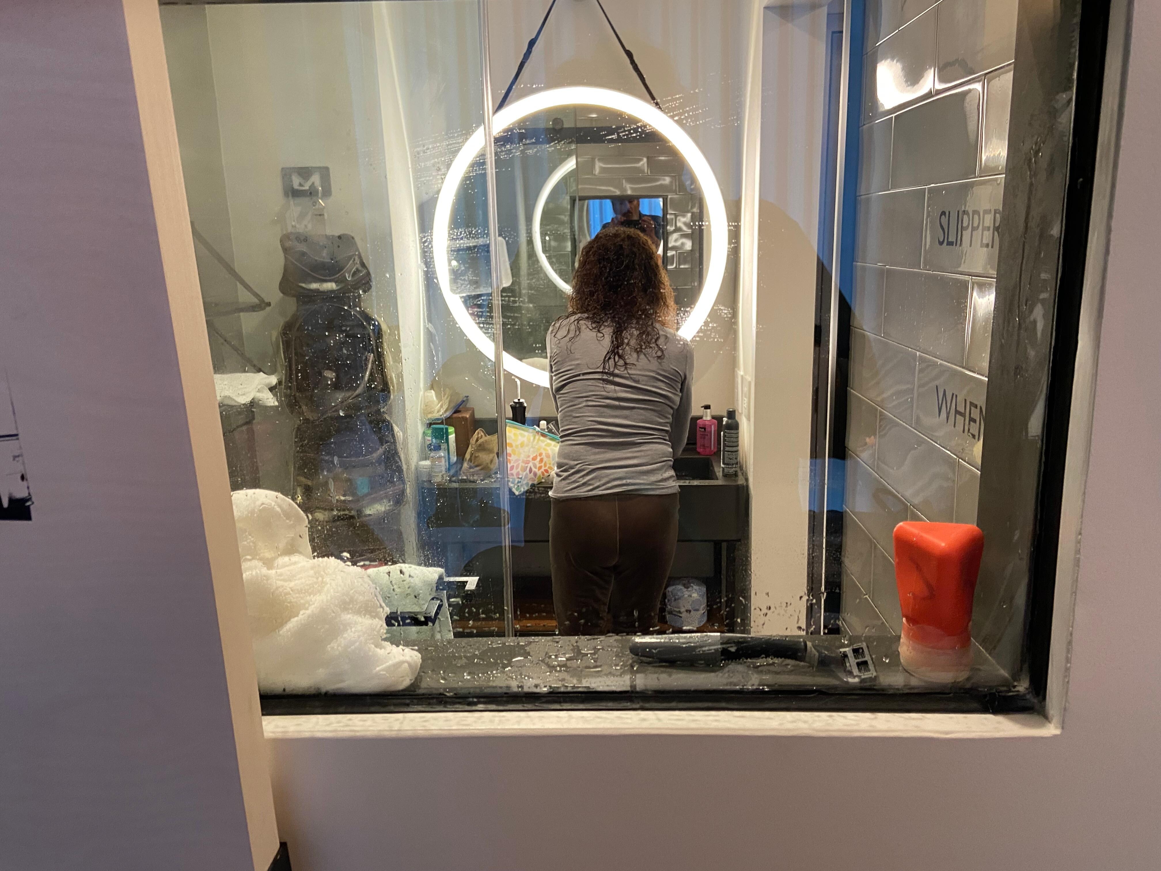 Voila! The picture slides to the side to allow a nice view into the bathroom. WTF?