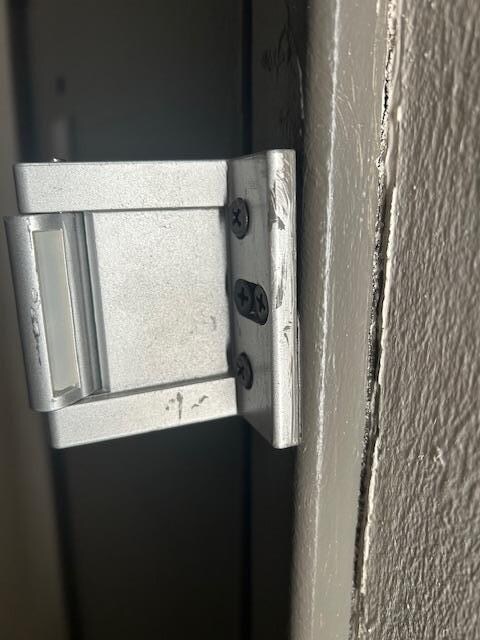 Deadbolt barley on the wall