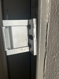 Deadbolt barley on the wall