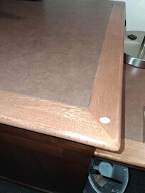 Some kind of spitball looking thing on the TV Stand