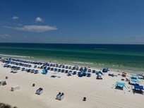 View from the balcony of the chairs and umbrellas for Tropic Winds