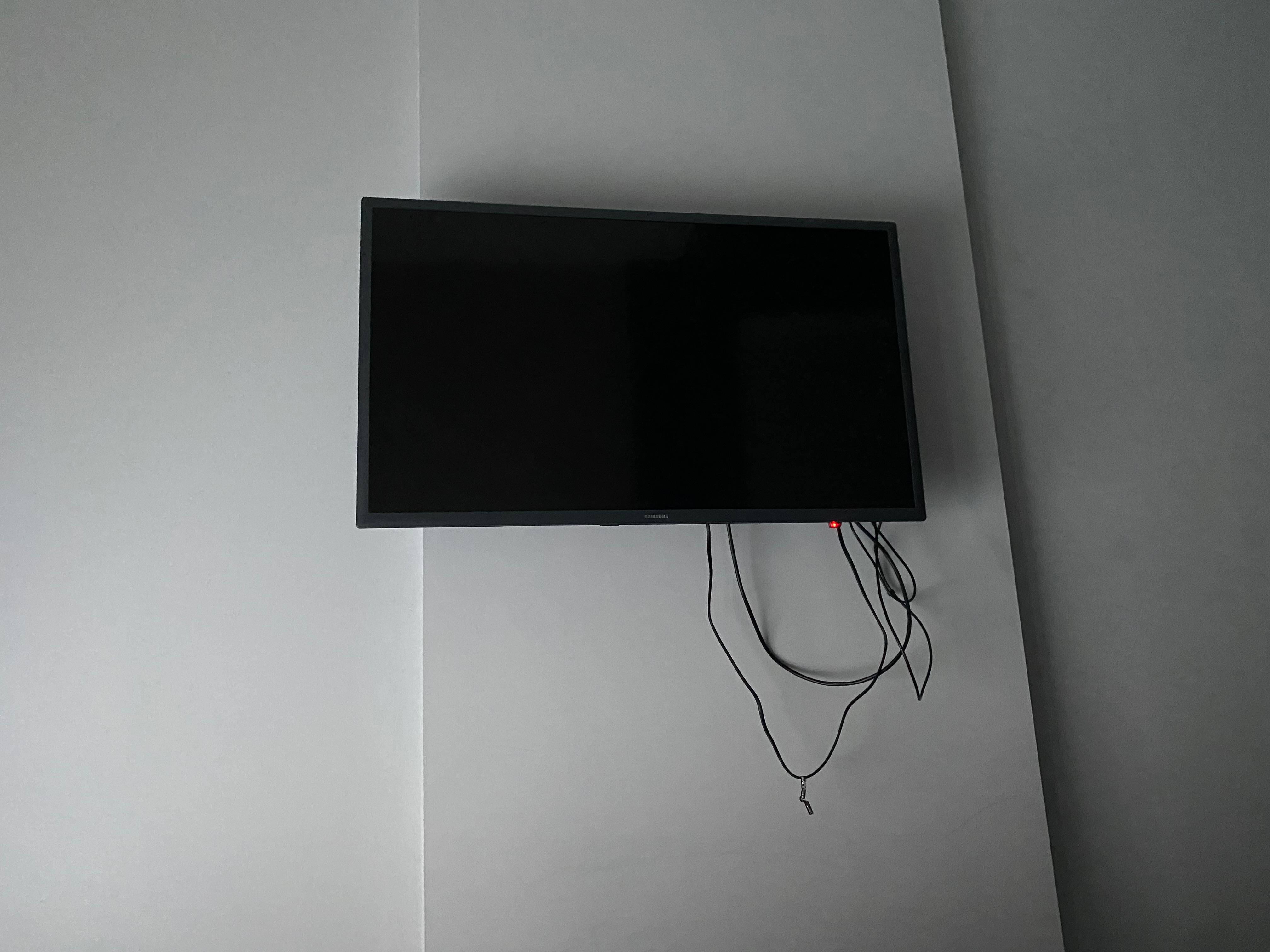 To wires hanging off and half on wall. 