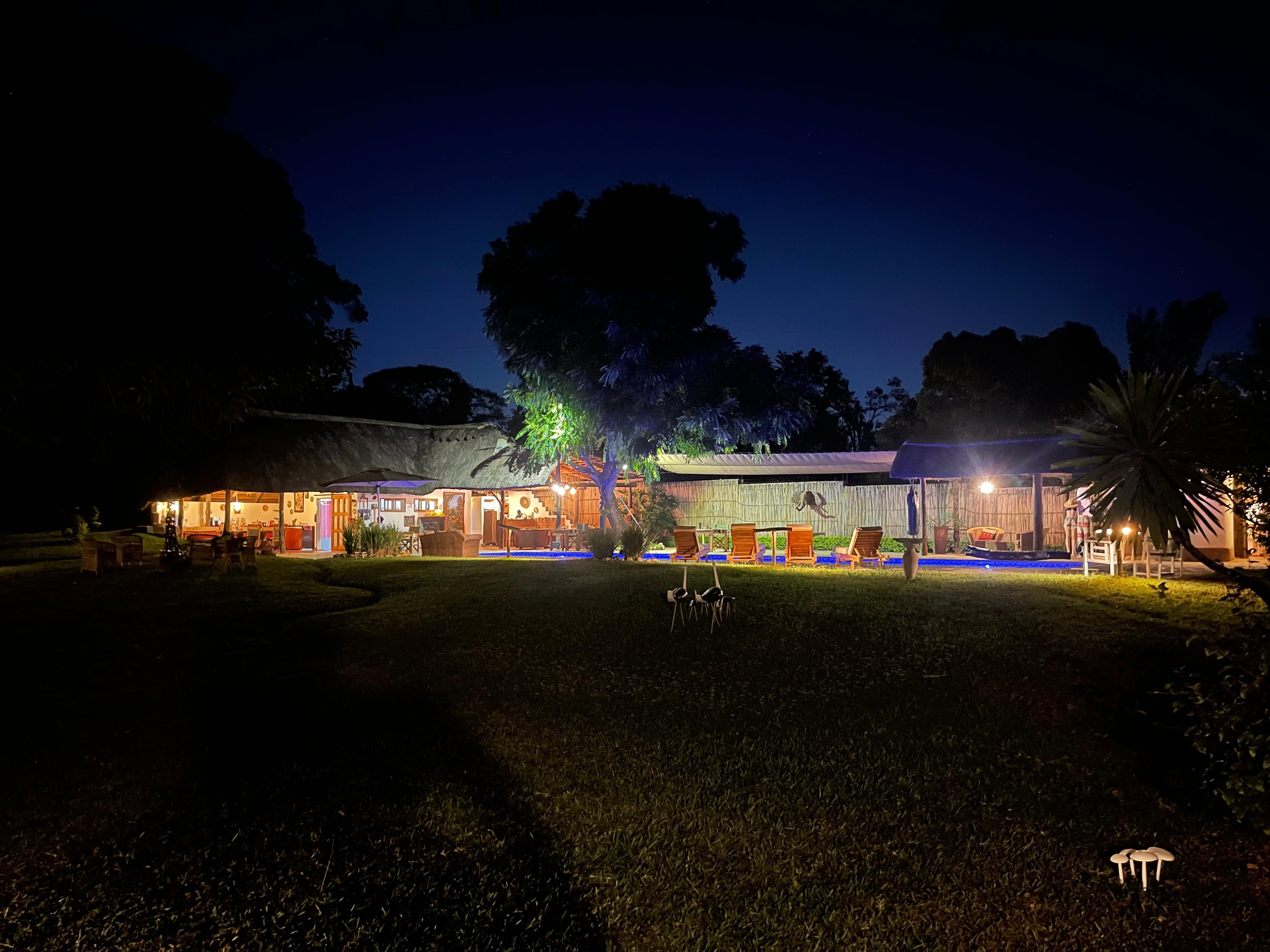 Pool and dining/bar area at night