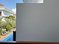 Balcony facing brick wall