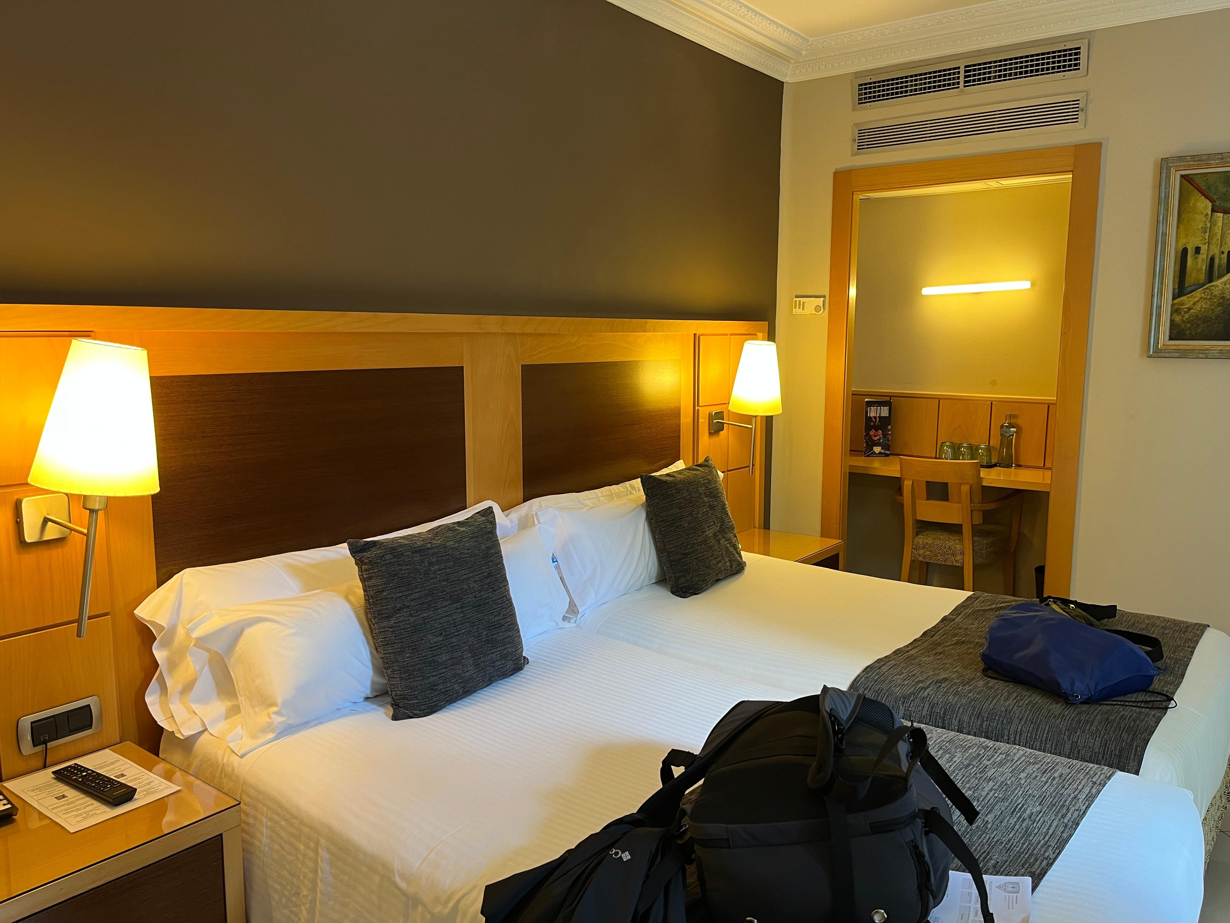 Beds roll to accommodate different setups. Desk and chair.