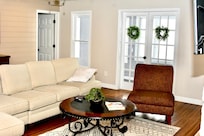 Another view of living room- the French doors in back open up to like an all season room with windows overlooking the Mississippi. In the summertime, these doors also open to the outside patio.