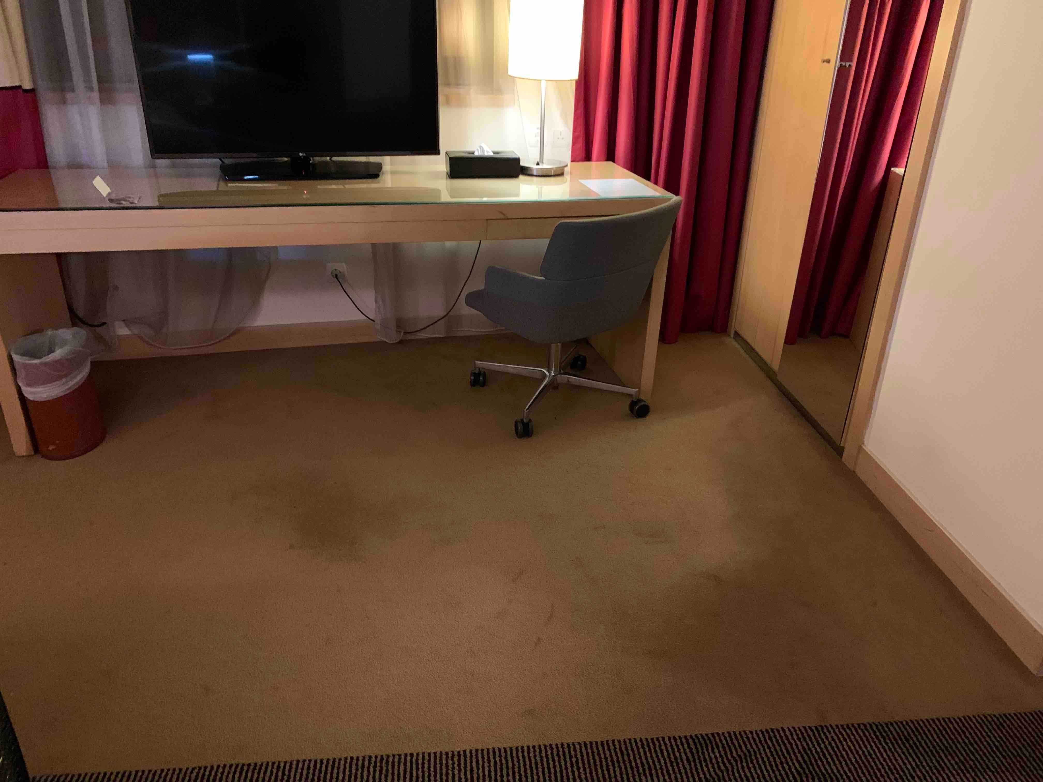 Stains on the carpet. Very  dirty. 