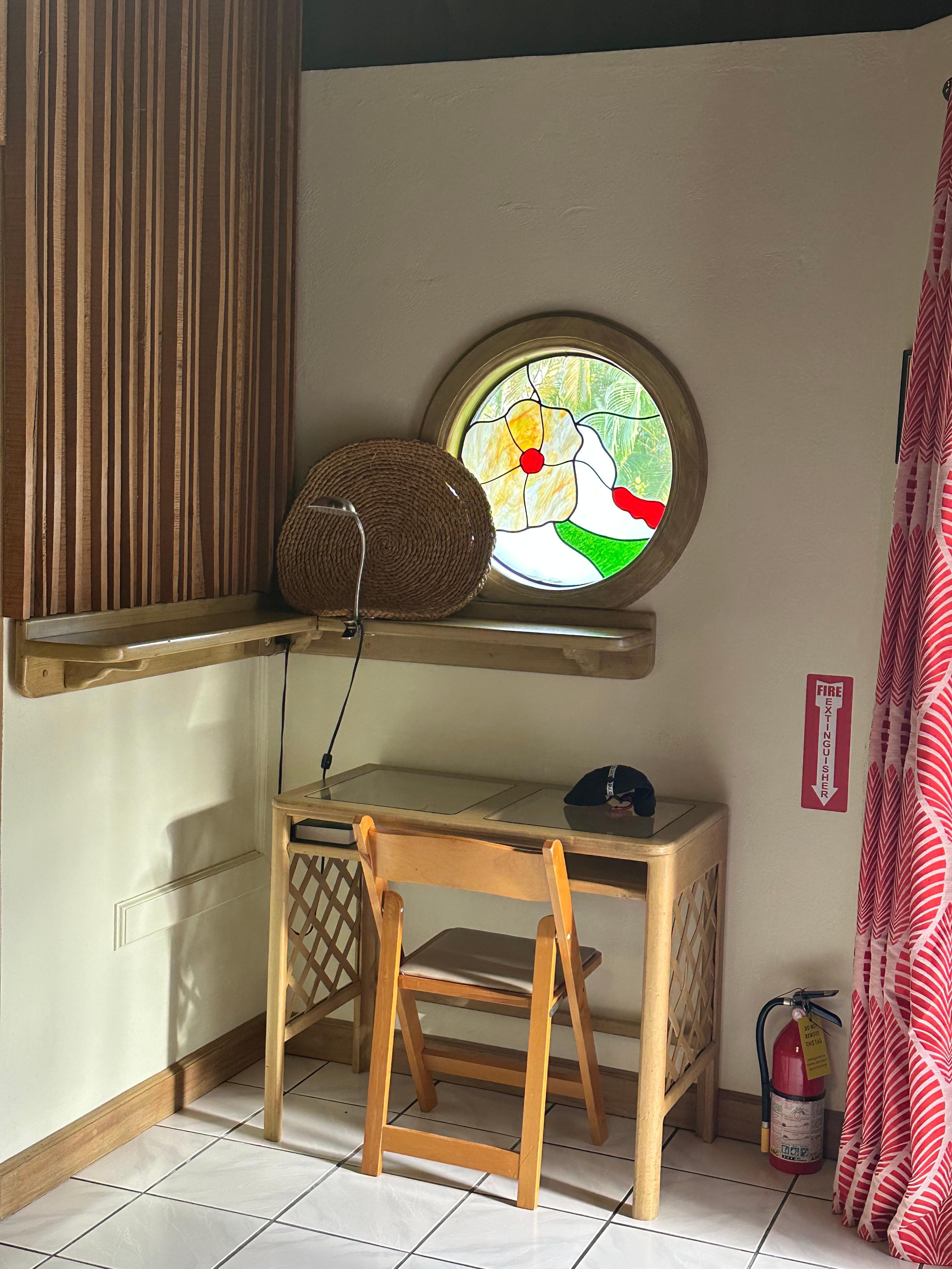 Beautiful stained glass window at the desk.