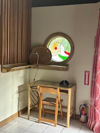 Beautiful stained glass window at the desk.