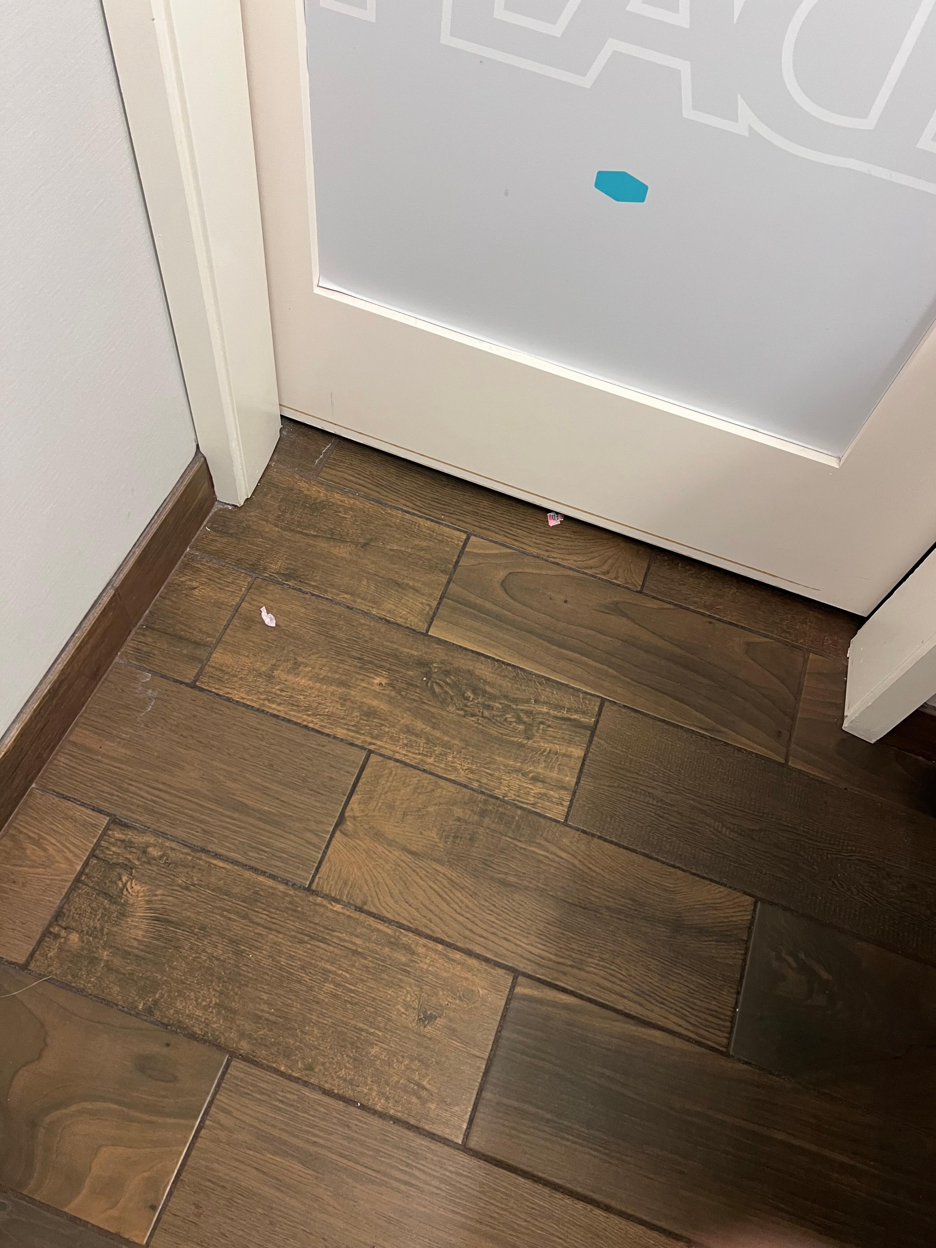 Candy wrappers on bathroom floor