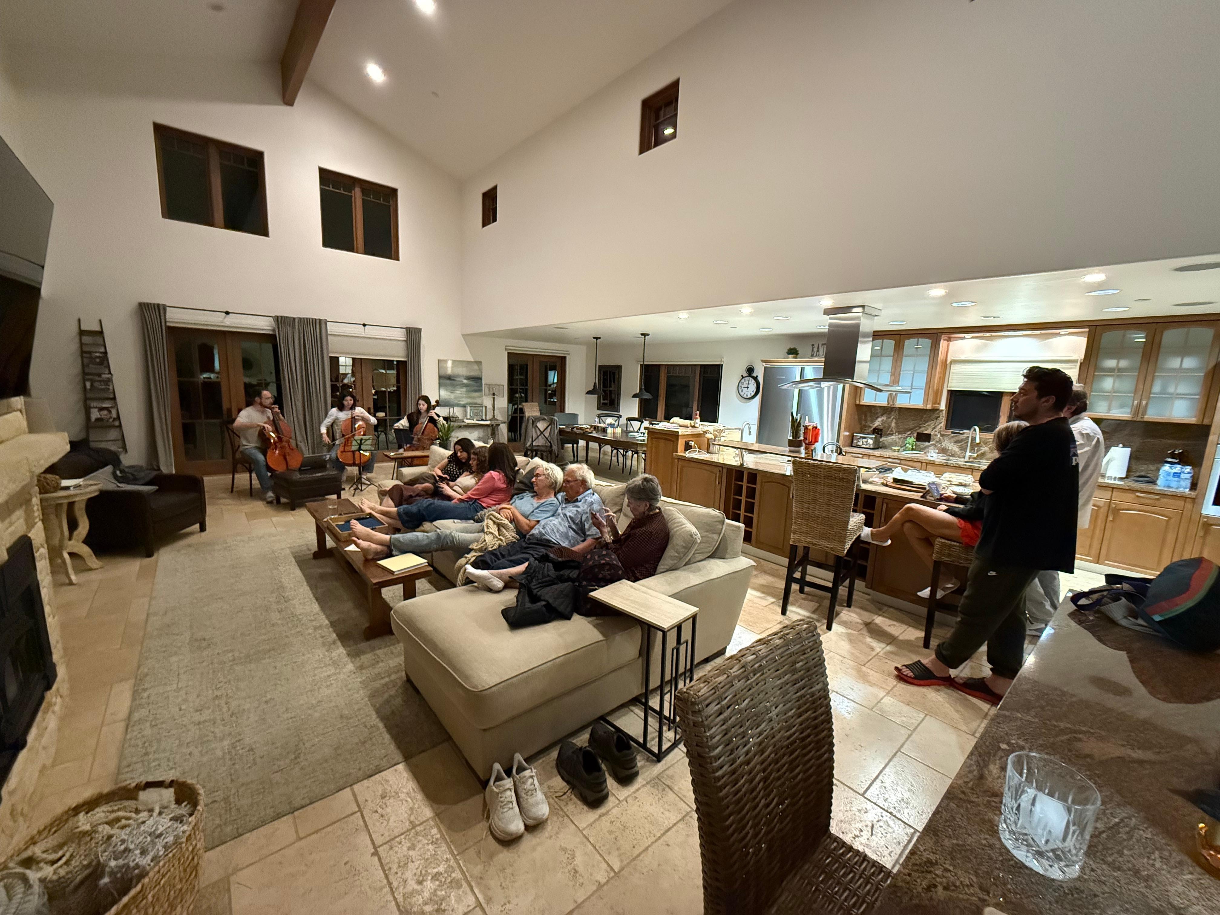 Two grandchildren and a fiance play a cello concert, including an arrangement of Happy Birthday written by the youngest.