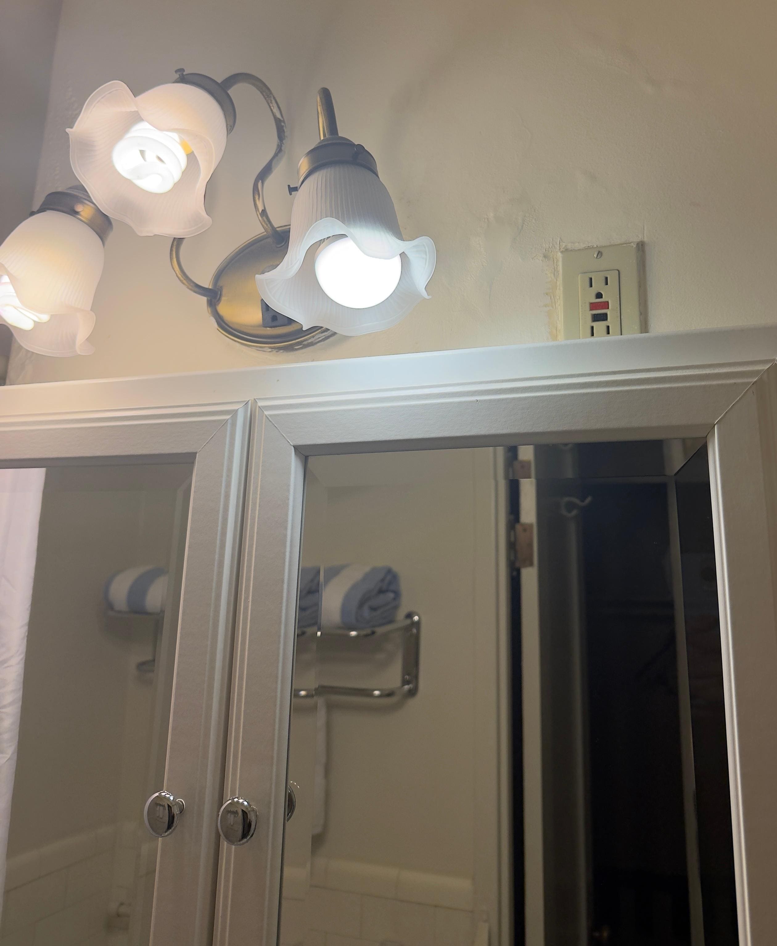 bathroom outlet at top of cabinet