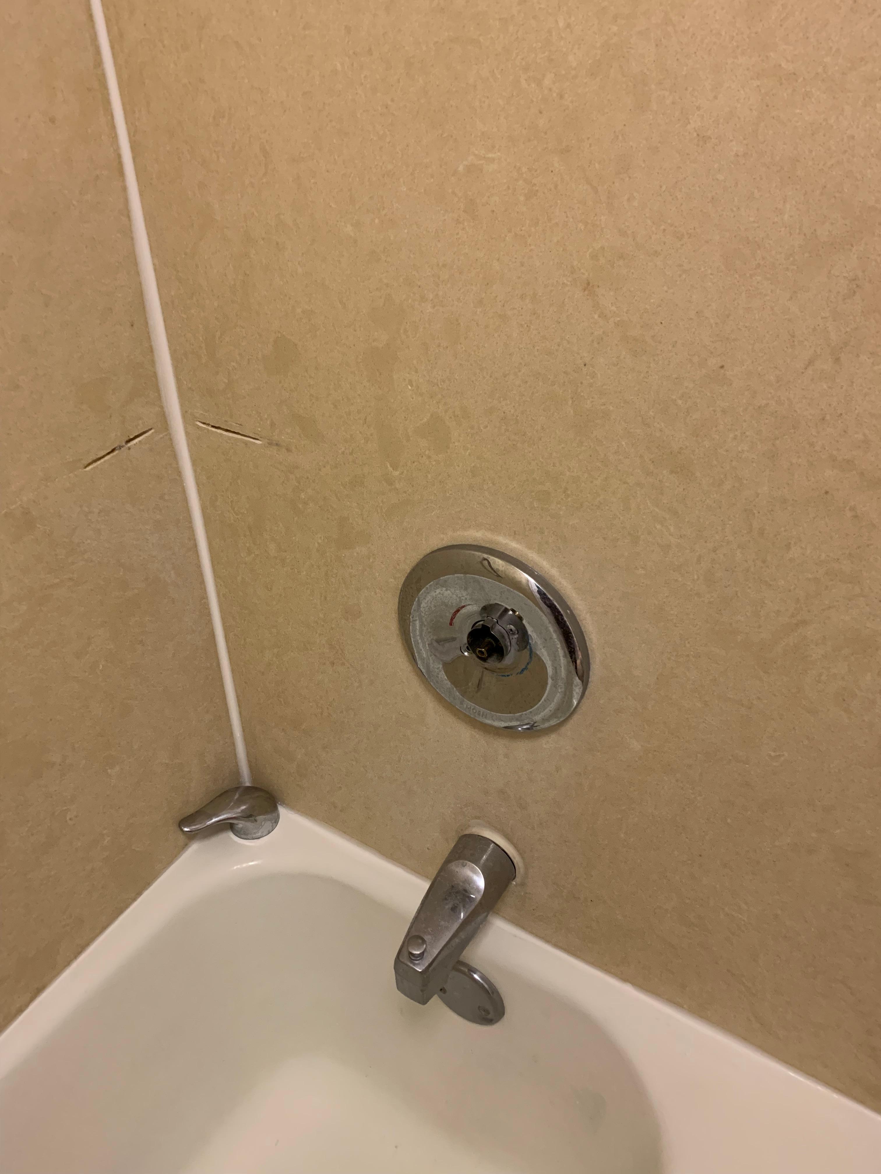 Shower handle broken but was placed on as if it was operating