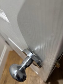Bathroom door handle hanging off