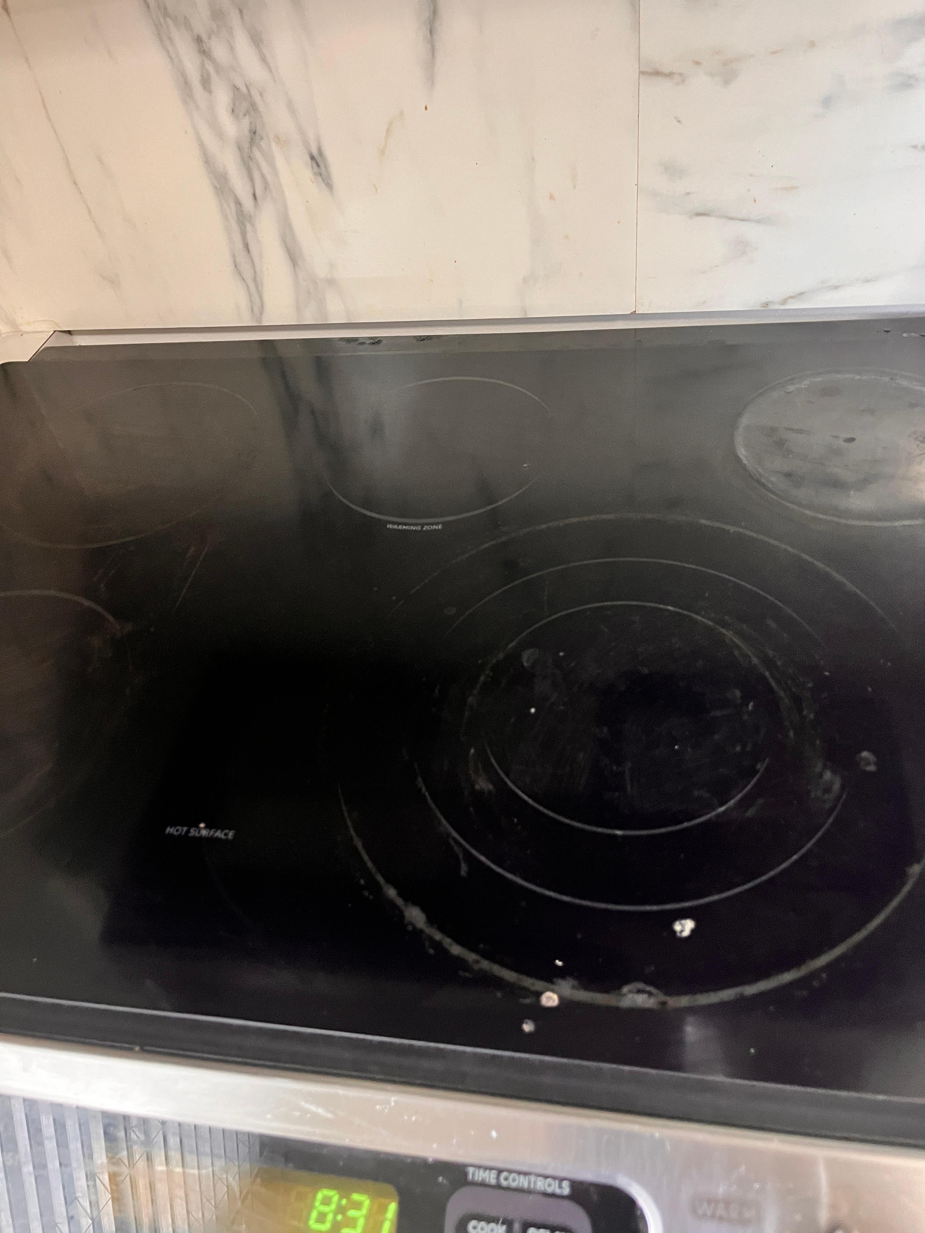 Greasy stovetop where cockroaches were!