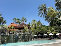 Pool with waterfalls and swim up bar.