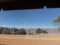 This is what they mean my partial view. The lower half of the view is blocked by the roof of the lower building. Kind of frustrating but you do see the top of the canyon from thr room.
