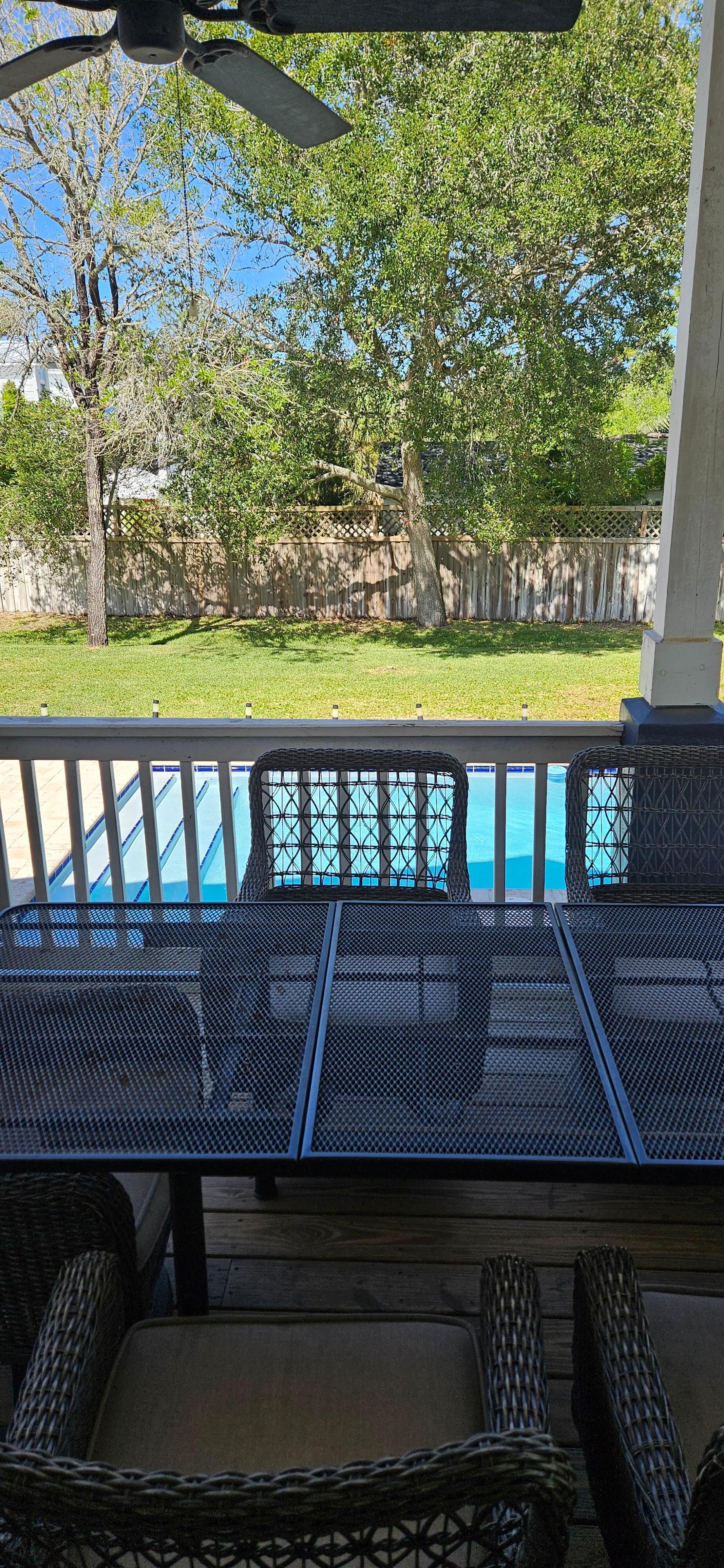 Covered porch overlooking the pool