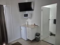 Kitchen area with microwave and utensils