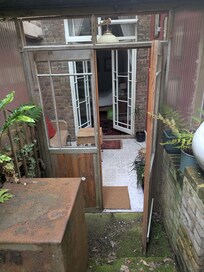 View of the sunroom from the private patio.