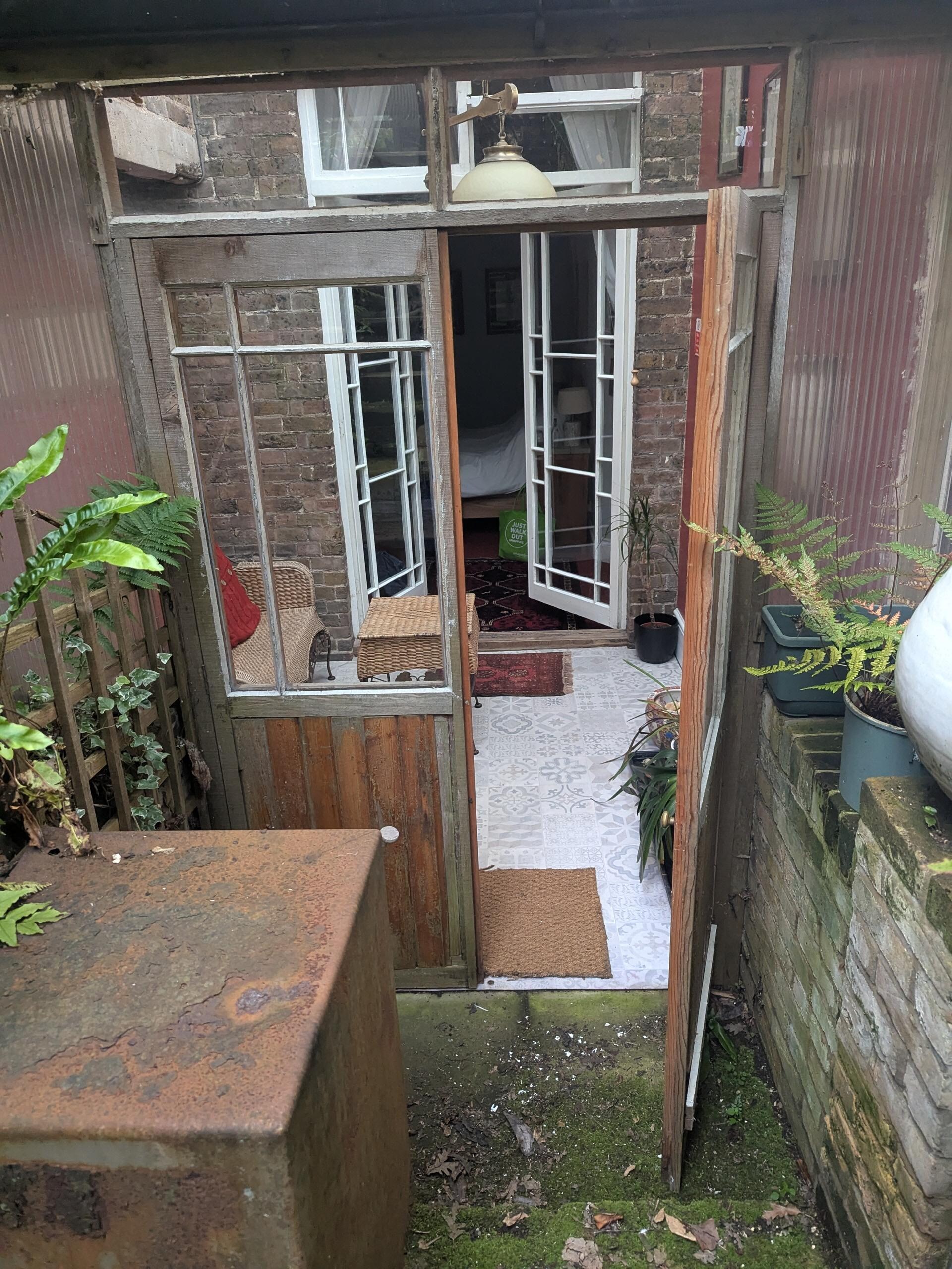 View of the sunroom from the private patio. 
