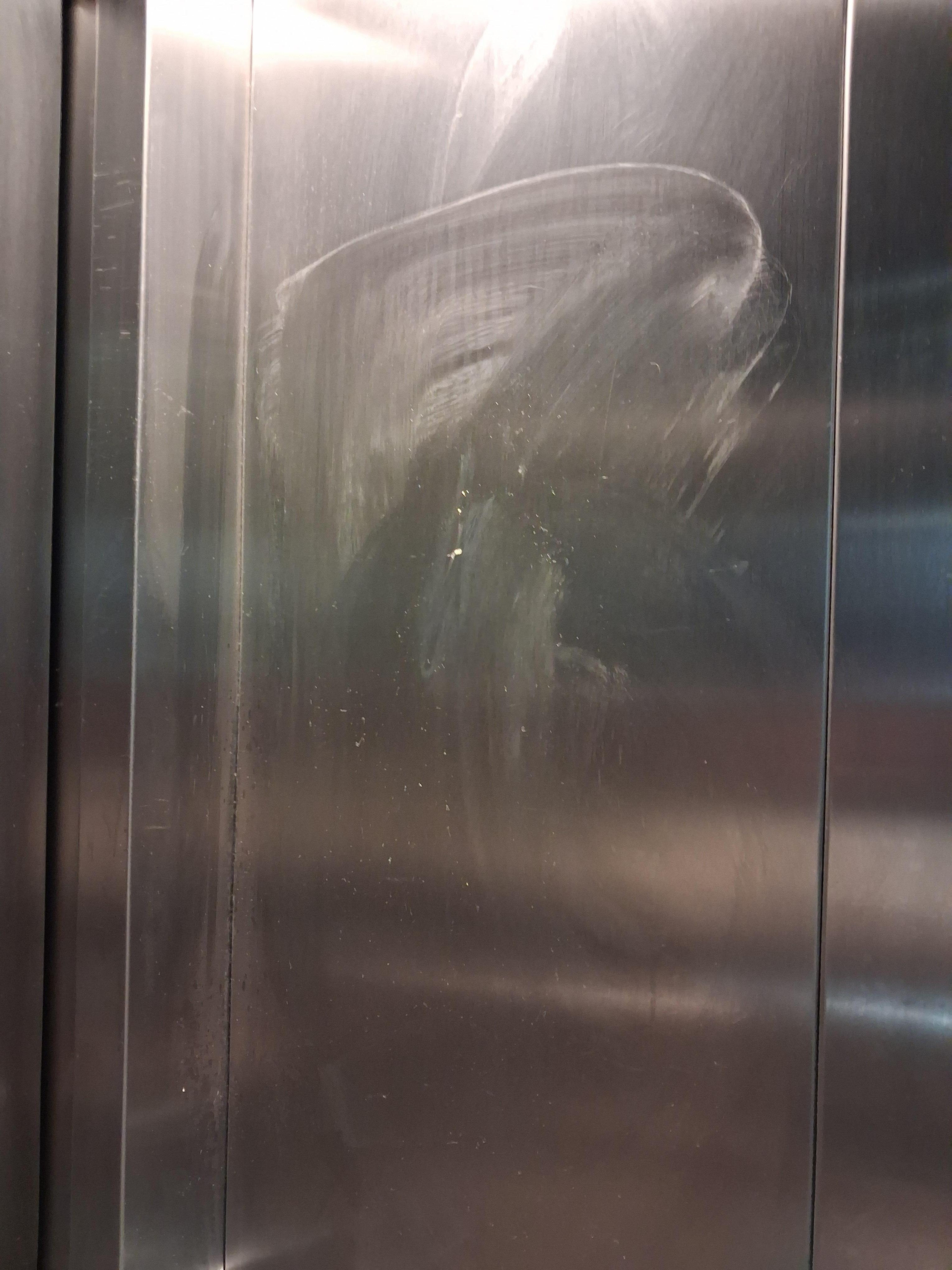 The lift was smeared with something and one of the buttons was missing. 