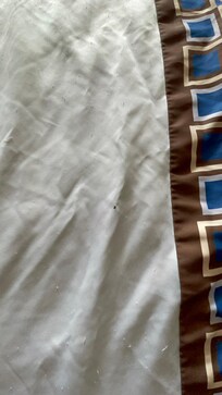 Nasty old sheets with cigarette burns and holes.