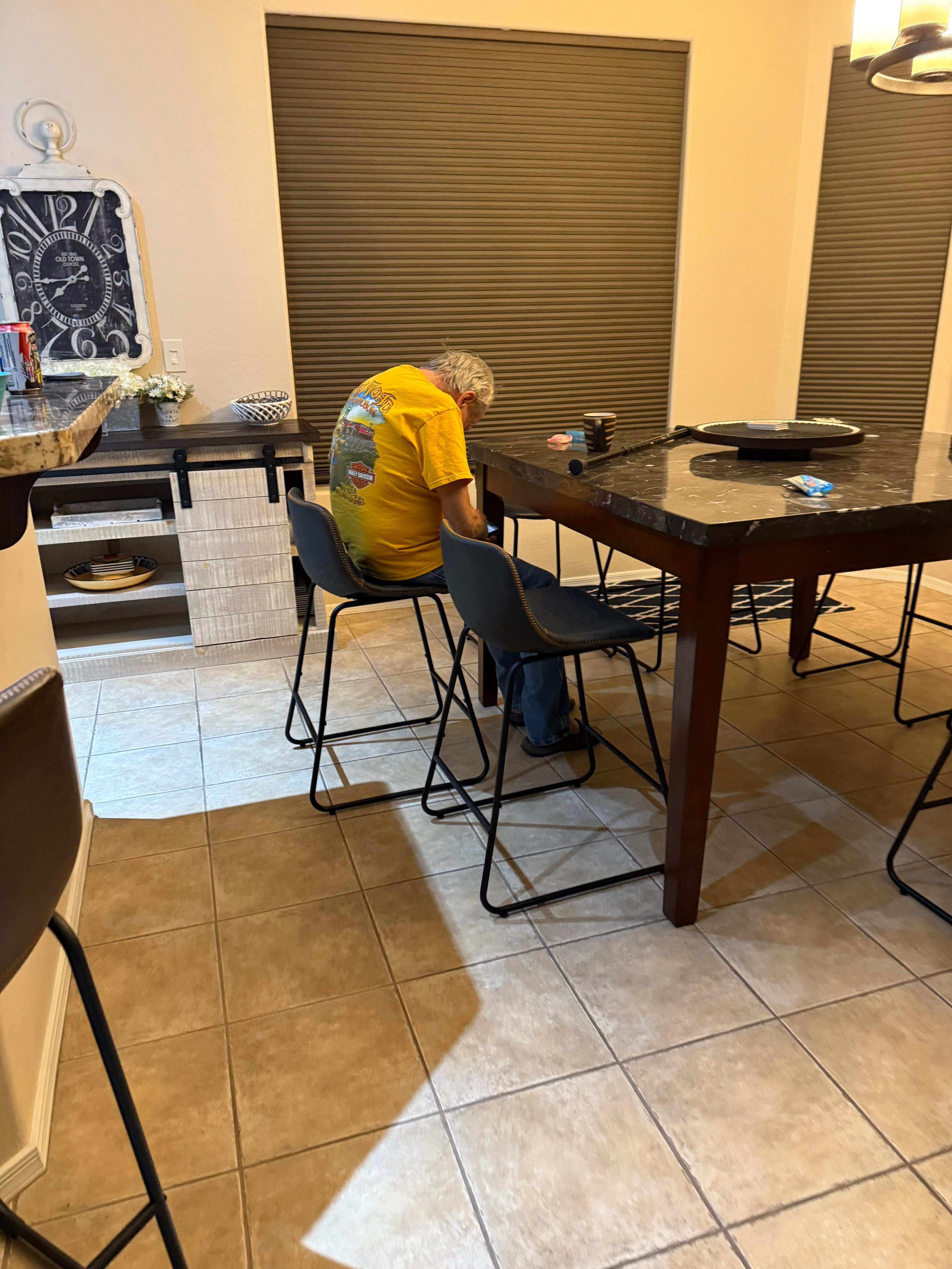 Bar height table, which was fine for us younger family, but my elderly father had a hard time sitting high for his meals. 