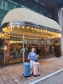 In front of the building.