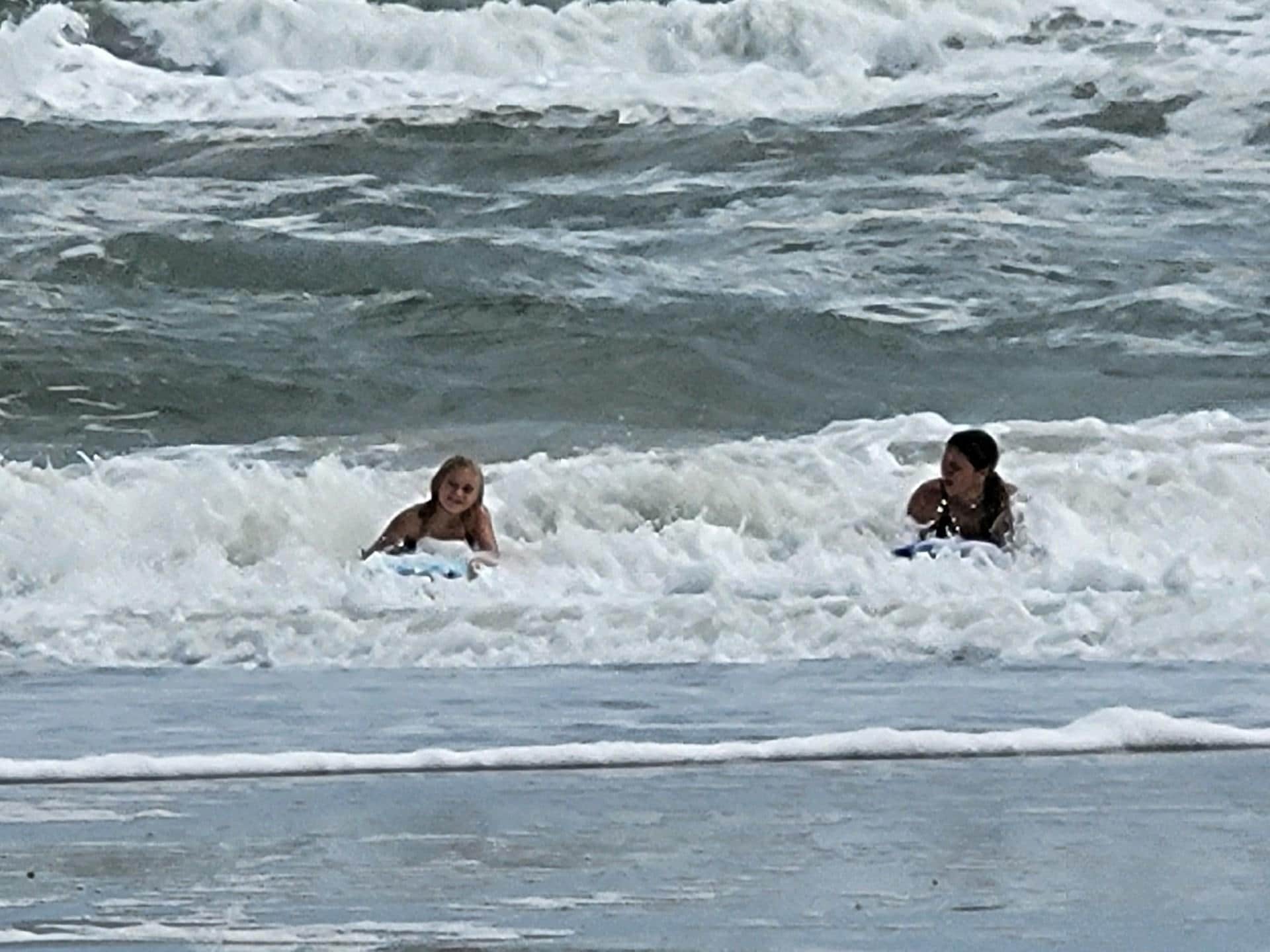 Daughter and Granddaughter boogie boarding.