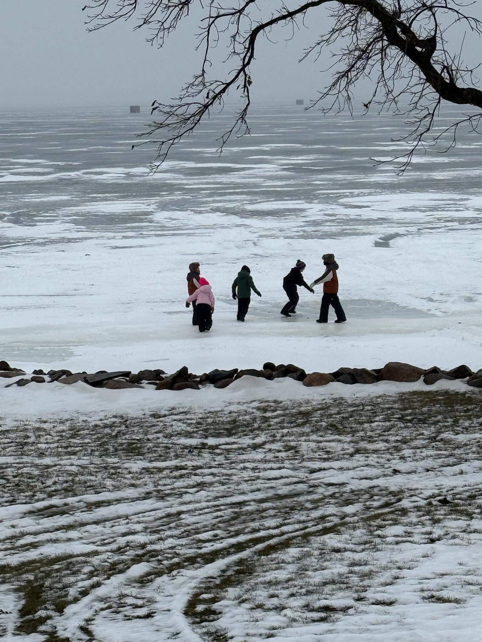 Youngest of the bunch out playing on the ice.