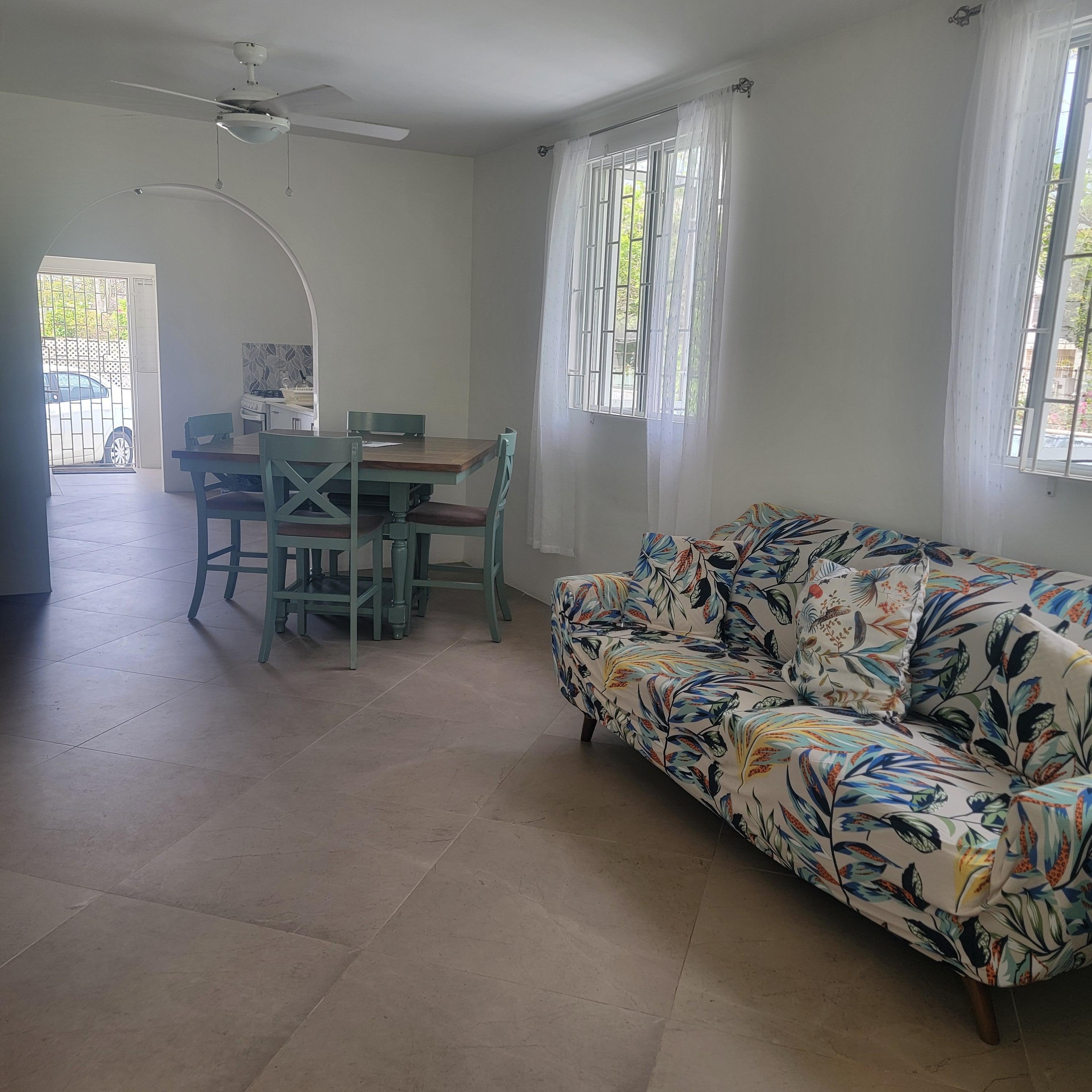 The living, dining, and kitchen area