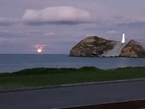 Sunset amazing with lighthouse lit up