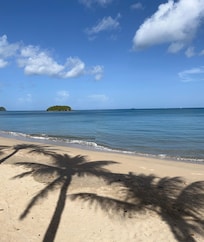 The beach directly outside the property.