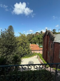 View from the balcony. You can see a patio below accessible by 2 flights of stairs.