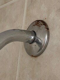 Grime on shower head base