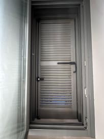 Opening the window reveals an inoperable exterior shutter
