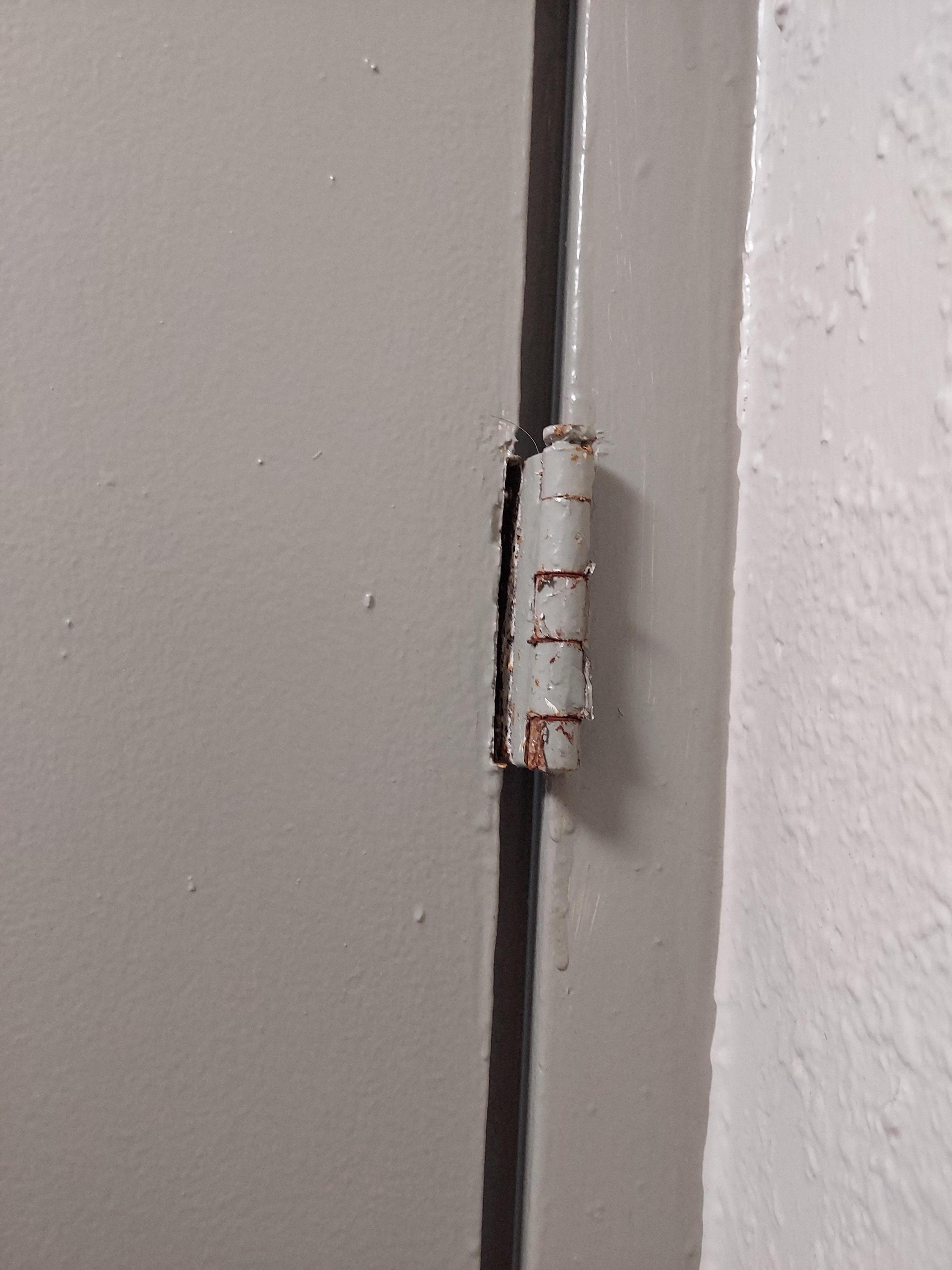 broken hinge on bathroom door