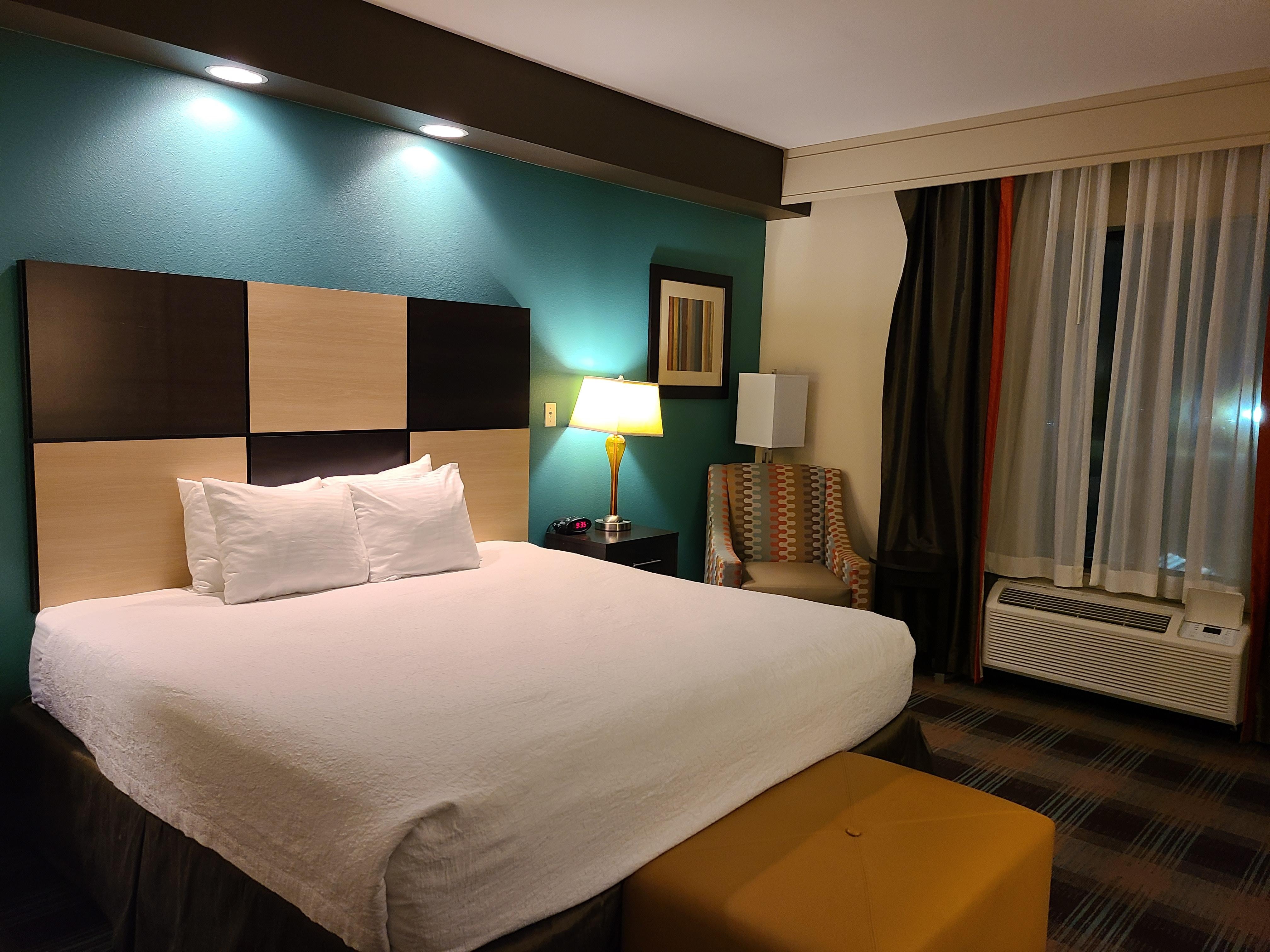 Comfy king-size bed and nice chair for reading or watching TV