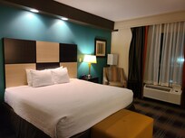 Comfy king-size bed and nice chair for reading or watching TV