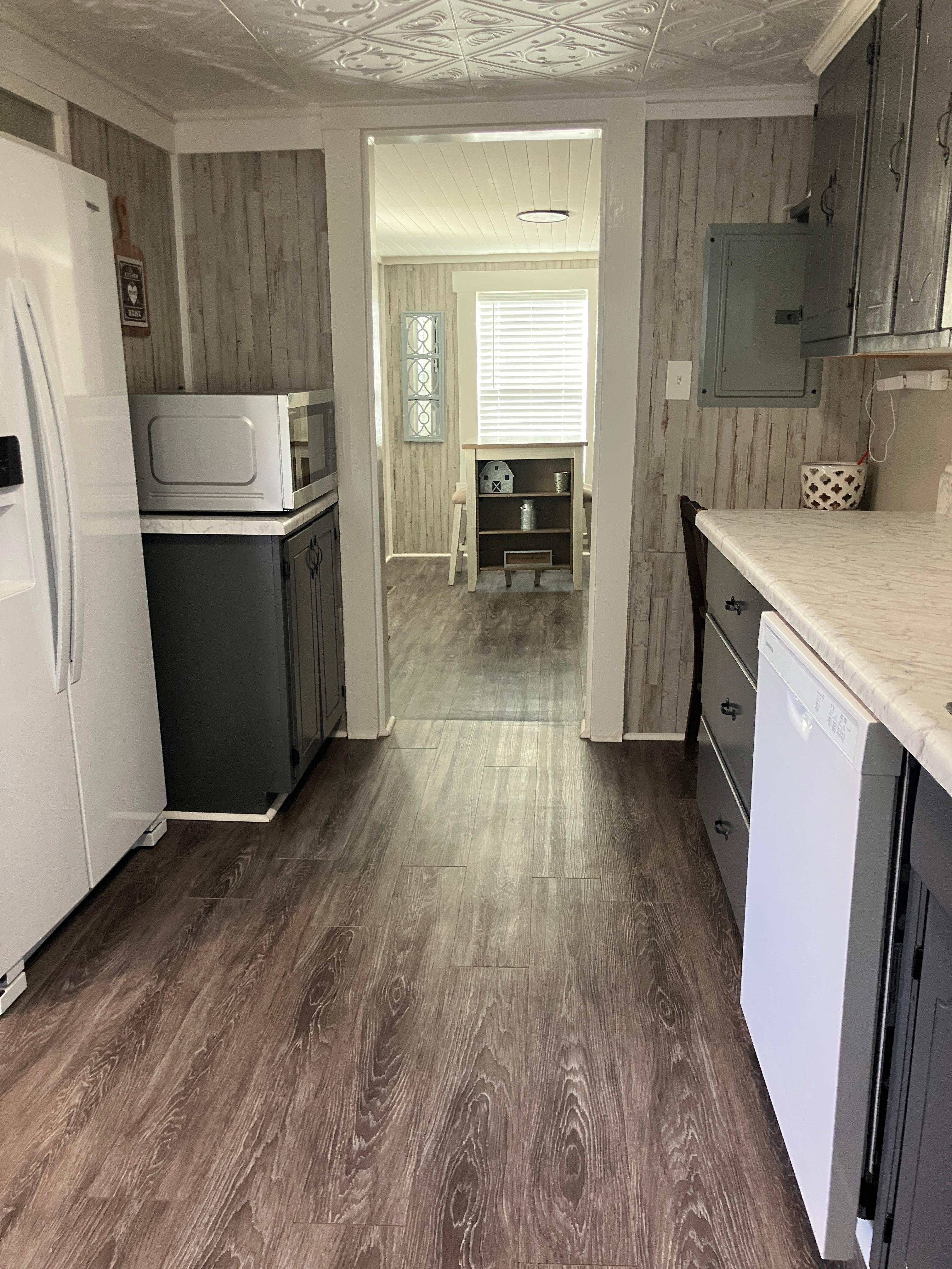 The kitchen has a full size fridge with an ice maker and water dispenser. 