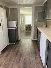 The kitchen has a full size fridge with an ice maker and water dispenser.