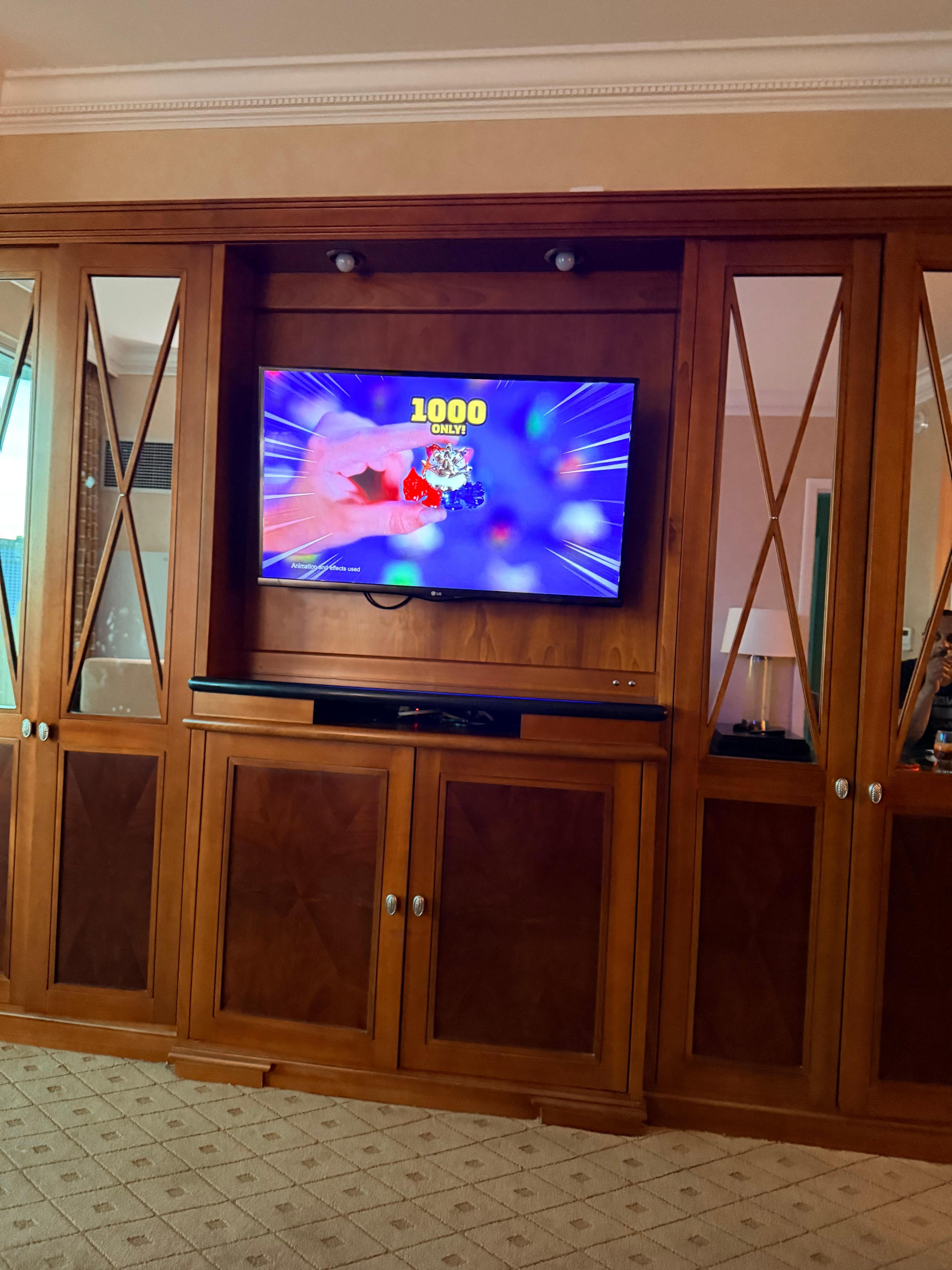 TV in living room with drawers and cabinets