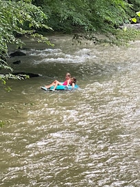 Kids floating in the creek