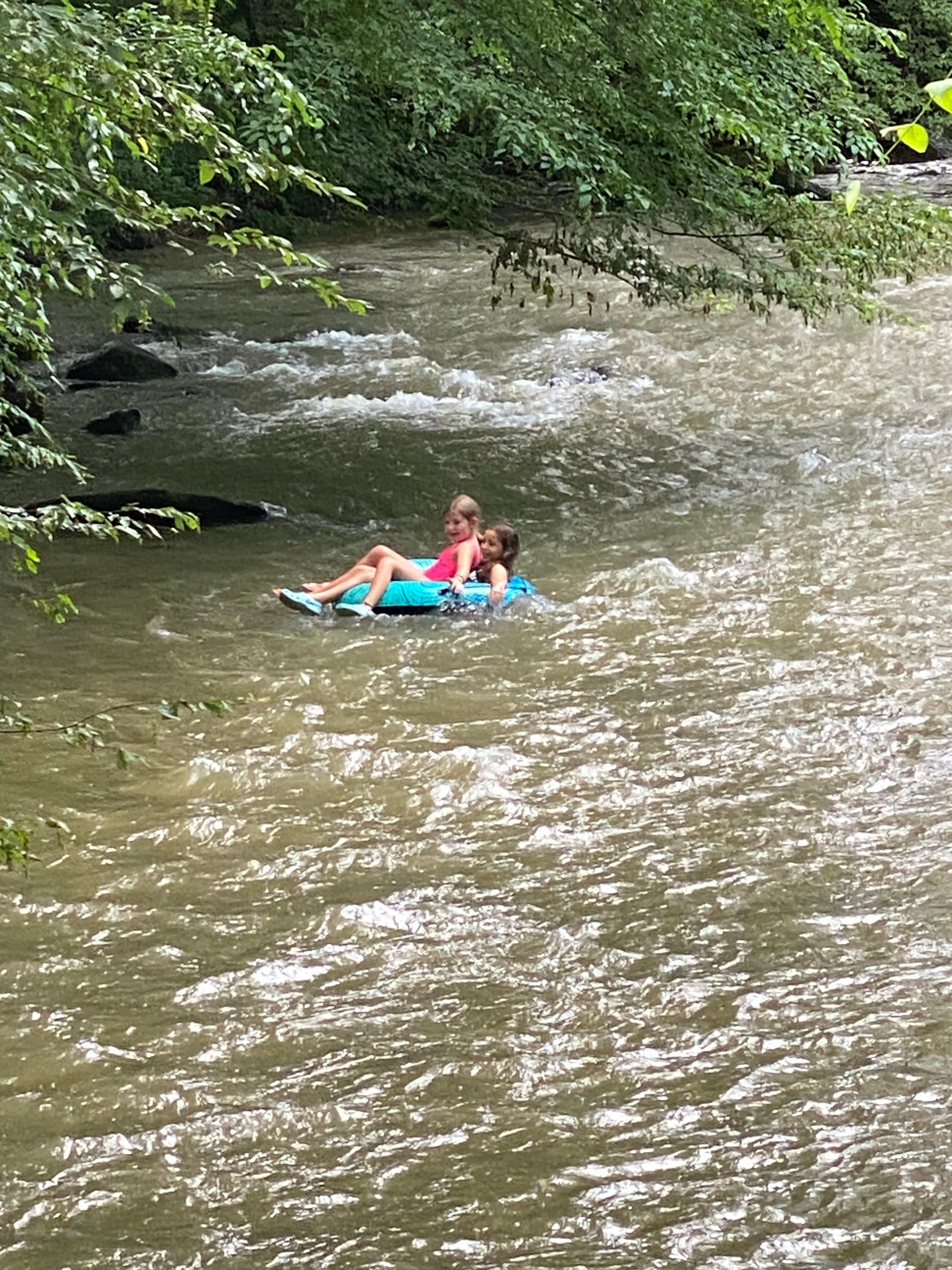 Kids floating in the creek