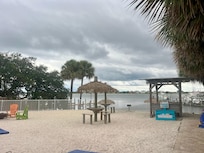 Beach by the water behind the hotel