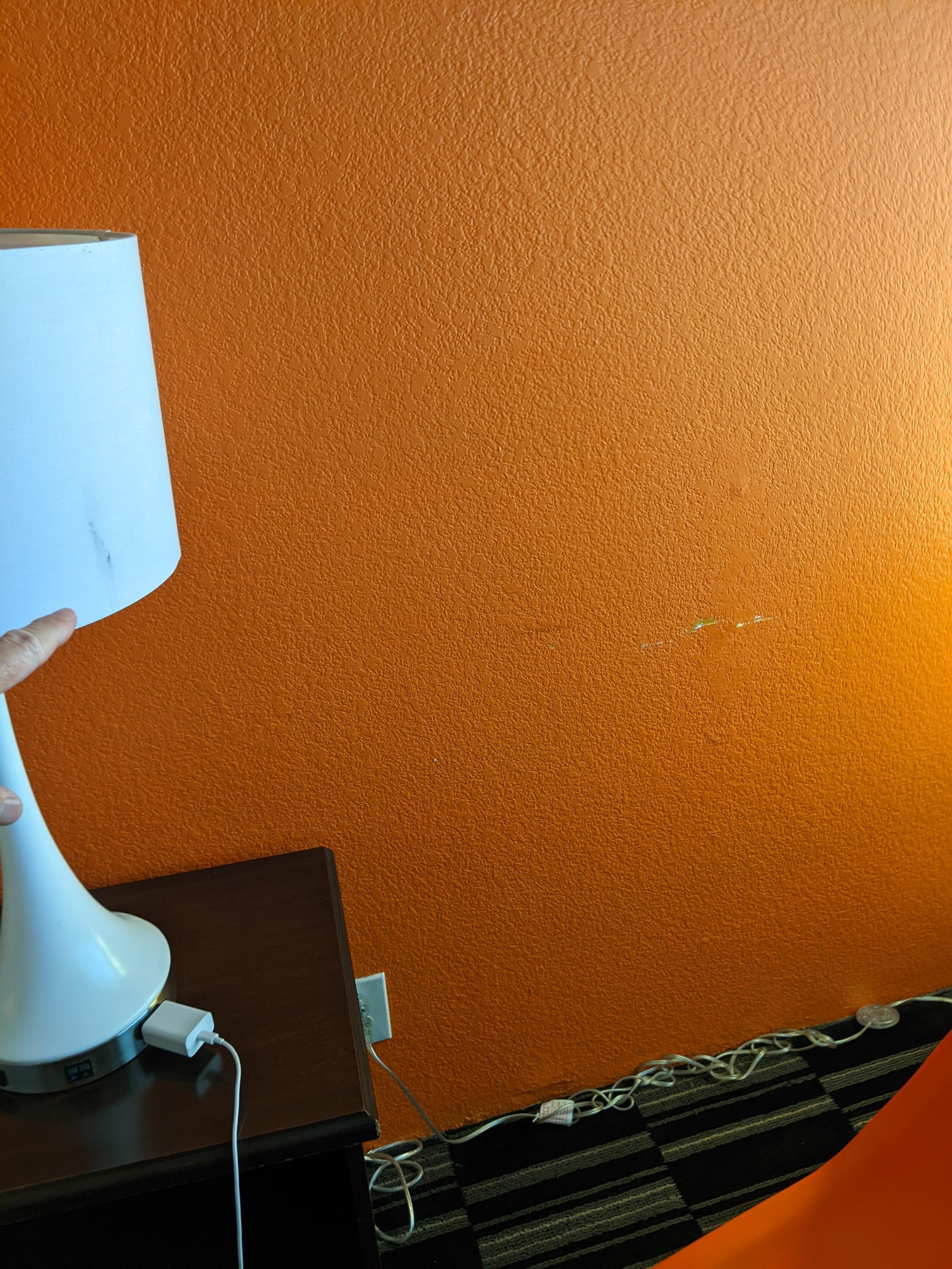 Dirt on lampshade, wall paint peeling