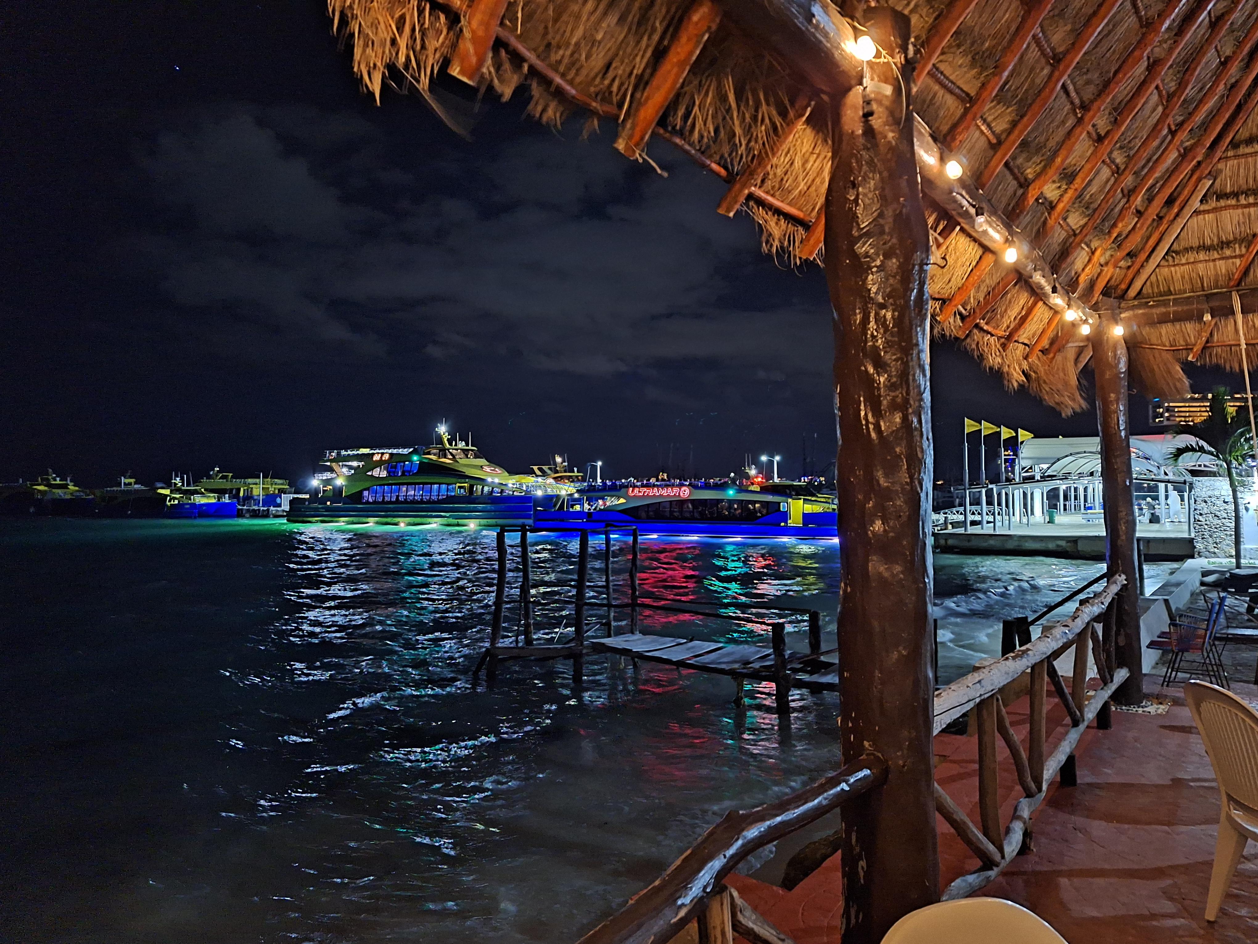 the patio at night, view of the ferry to Isla Mujeres